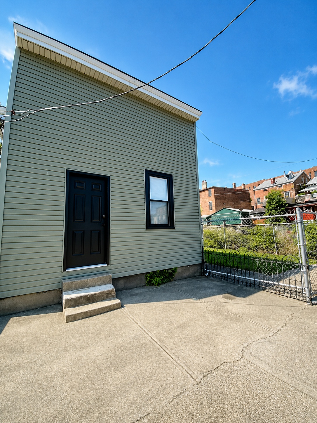 Front exterior of the rental house at 319 Pershing Ave in Covington, Kentucky at golden hour